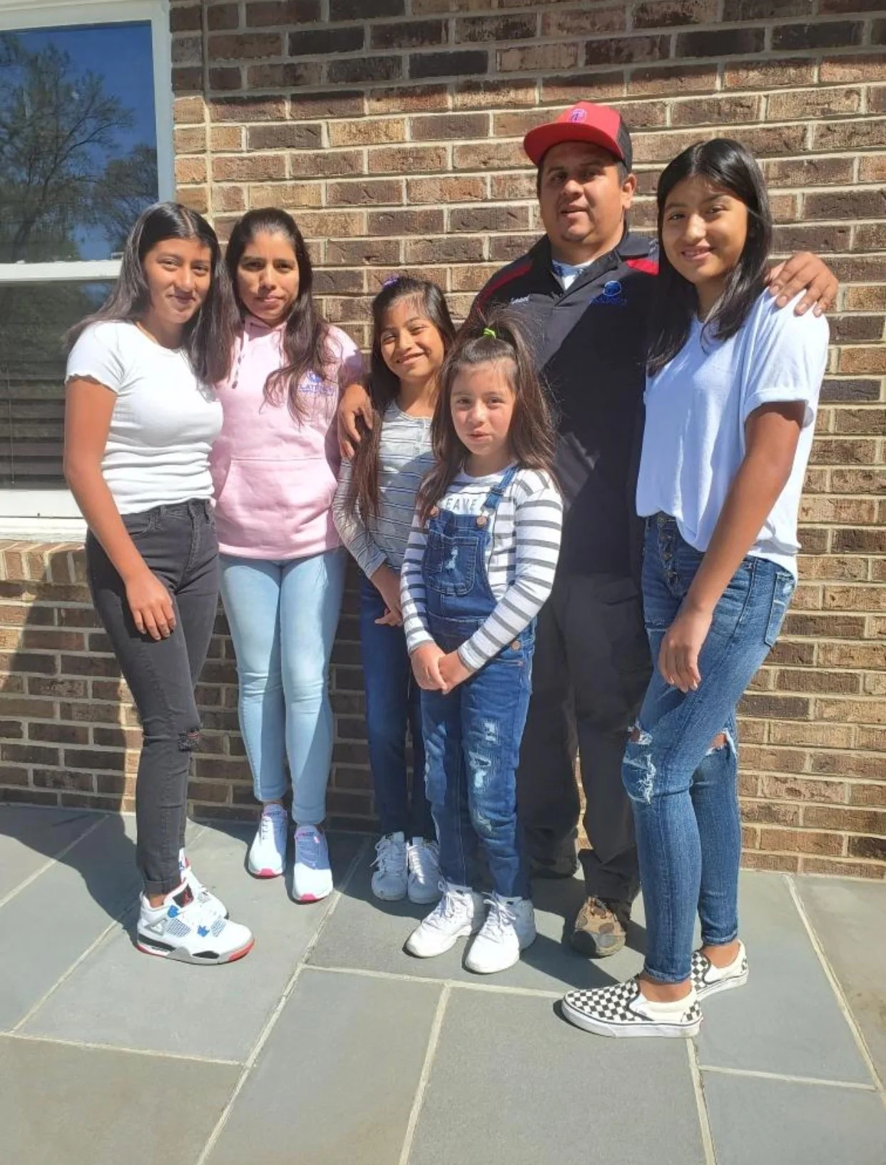 Israel Tlatenchi with his wife and four daughters
